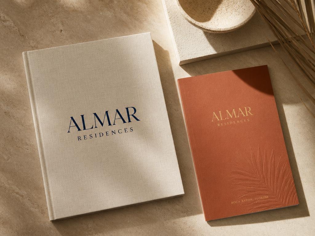 Luxury real estate brand book and brochure with cream linen and terracotta covers